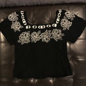 Black blouse with white flower embroidering